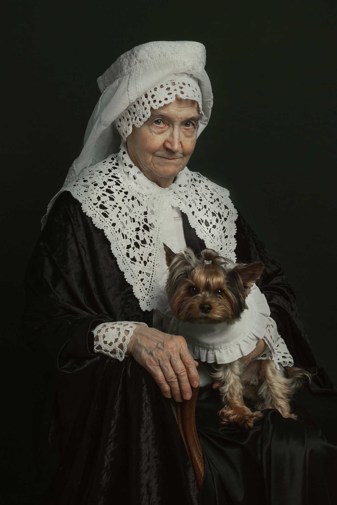 Portrait of a lady in white lace with a Yorkie