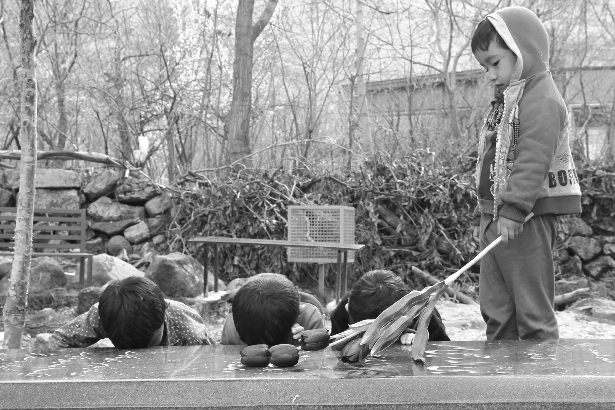Four brothers. Three bow. One brings flowers