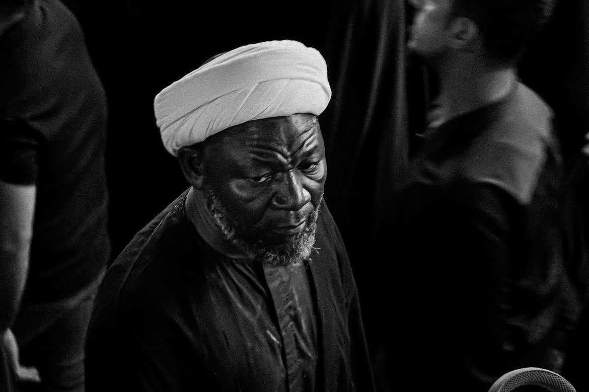 The photo shows a man from Nigeria wearing a turba